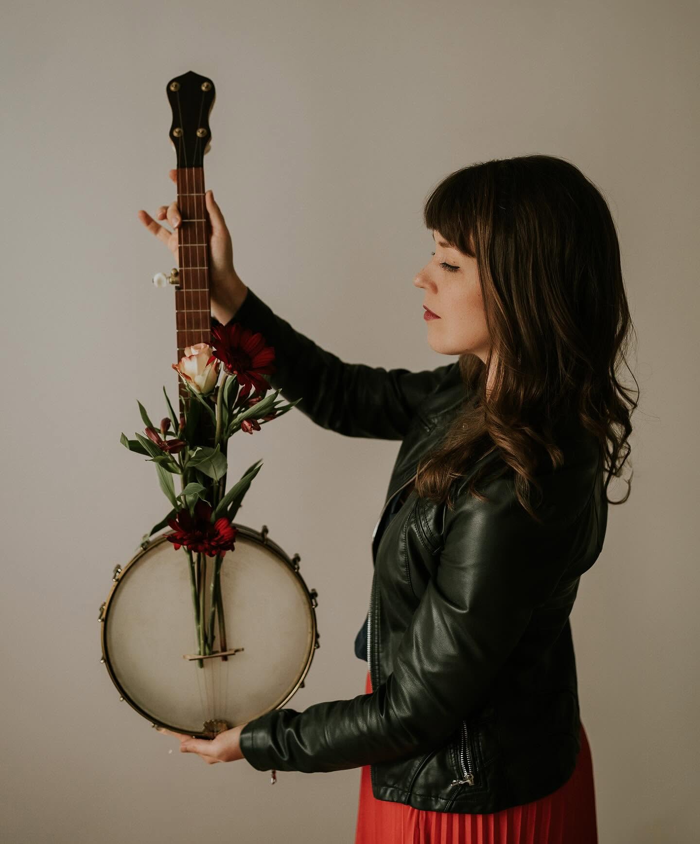 Hannah holding a banjo
